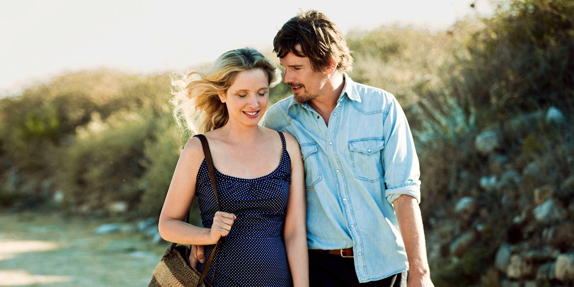 Ethan Hawke and Julie Delpy as Jesse and Celine walking side by side in Before Midnight.