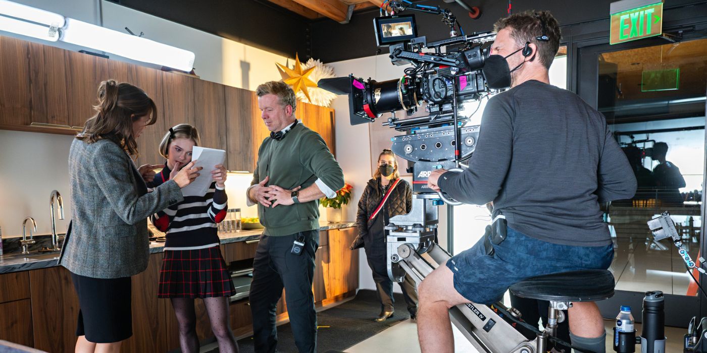 McG instructing Jennfier Garner and Emma Myers on the set of Family Switch
