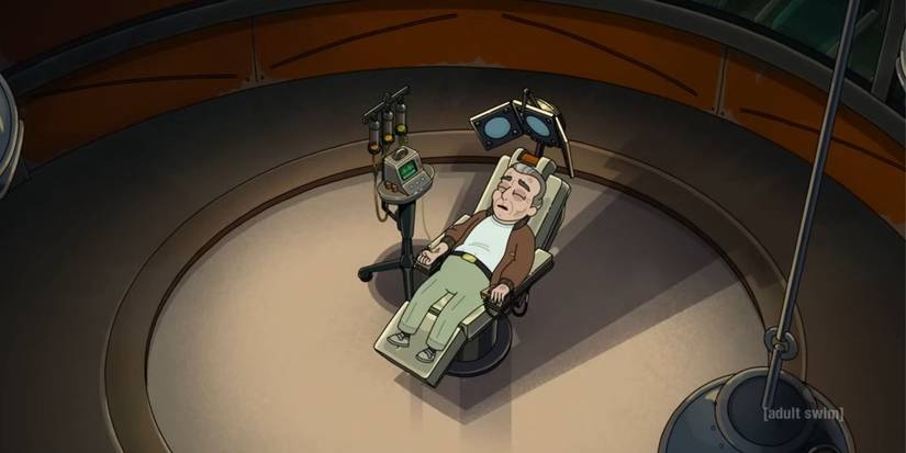 A man named Fred lays on a device in Rick and Morty.