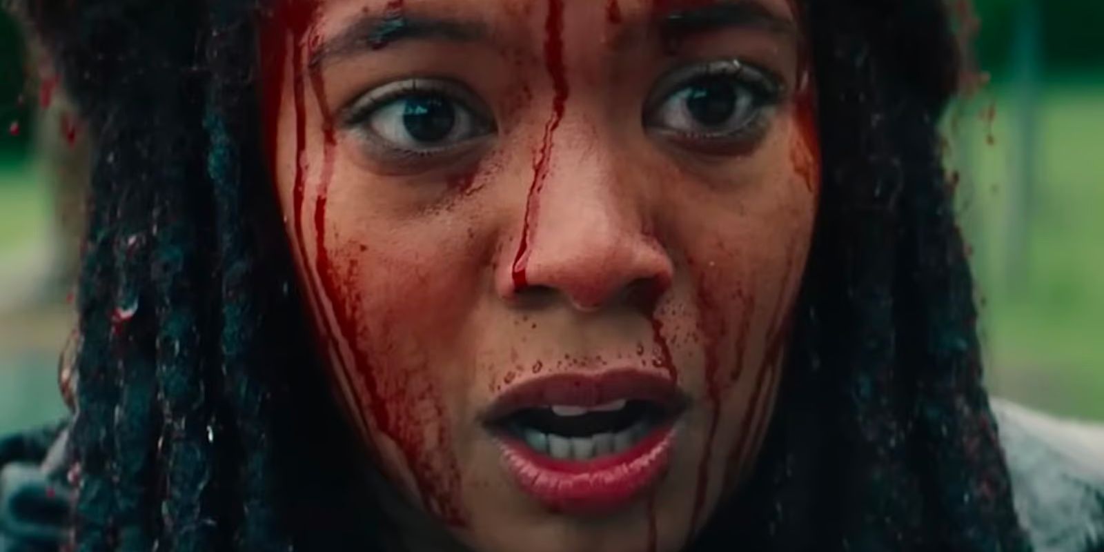 Marie Moreau (Jaz Sinclair) has a shocked expression as blood drips down her face.