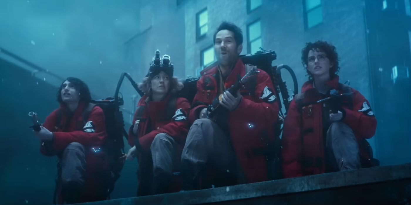 Finn Wolfhard, Carrie Coon, Paul Rudd, and McKenna Grace in red uniform in Ghostbusters: Frozen Empire