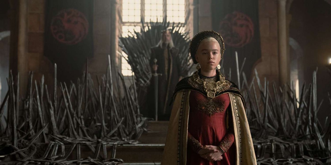 Milly Alcock as Princess Rhaenyra Targaryen standing in front of the Iron Thone.