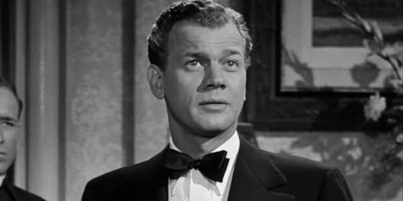 Joseph Cotten as Uncle Charlie wearing a suit and tie in Shadow of a Doubt (1943)