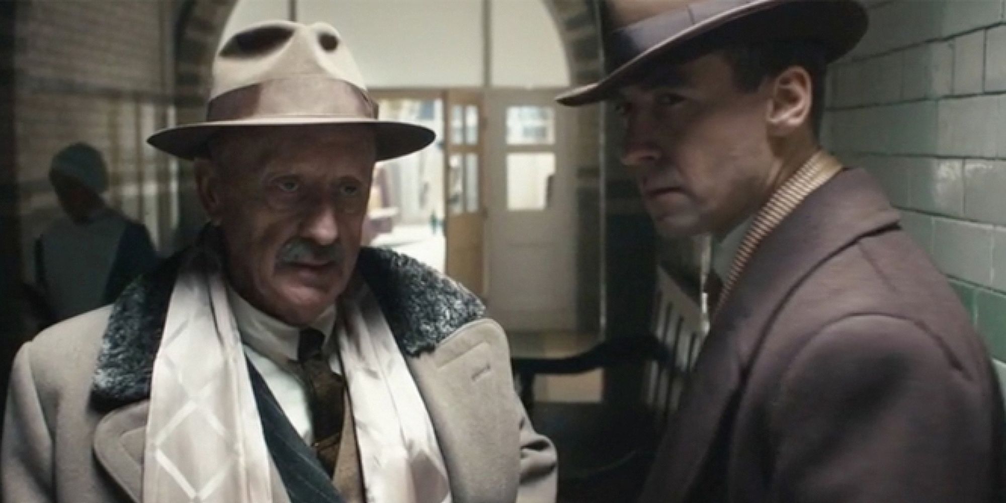Kenneth Colley and Pedro Caxade standing side by side in Peaky Blinders.