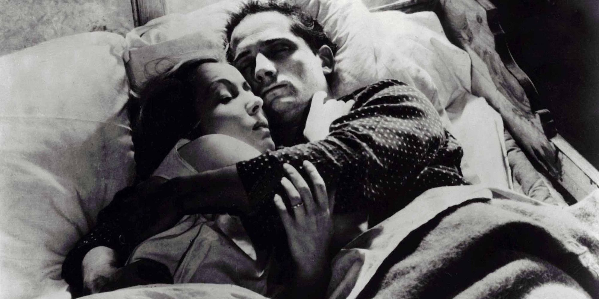 A couple lying together in a bed in the film L'Atalante