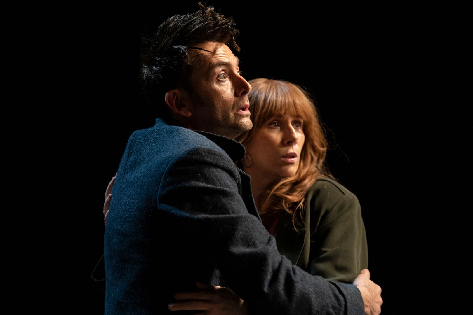 David Tennant as the Doctor and Catherine Tate as Donna Noble hugging in Doctor Who