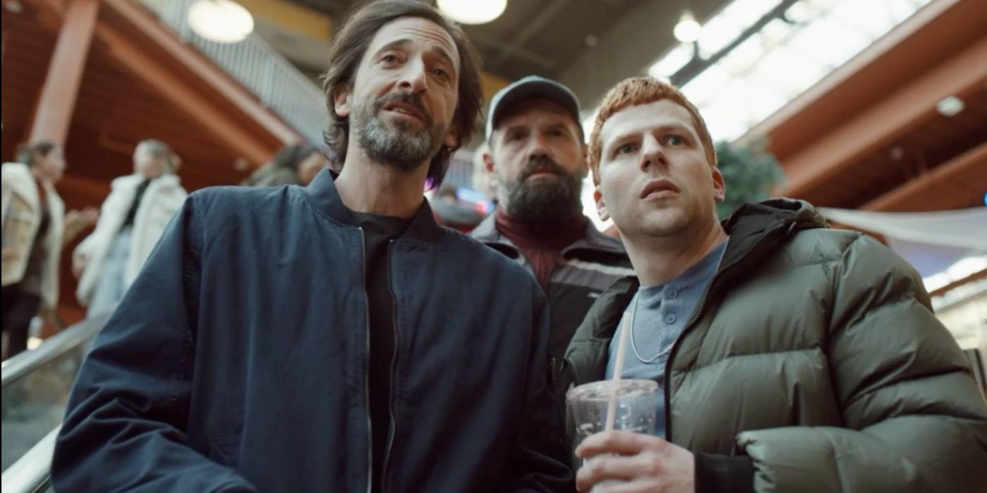 Adrien Brody, Ethan Suplee, and Jesse Eisenberg riding down as escalator as RDan, Leo, and Ralphie in Manodrome