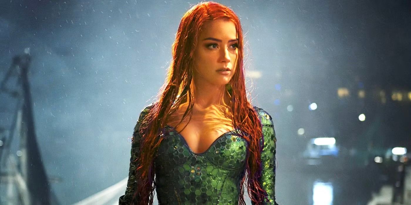 Atlantis warrior Mera stands by a body of water on a rainy night in Aquaman