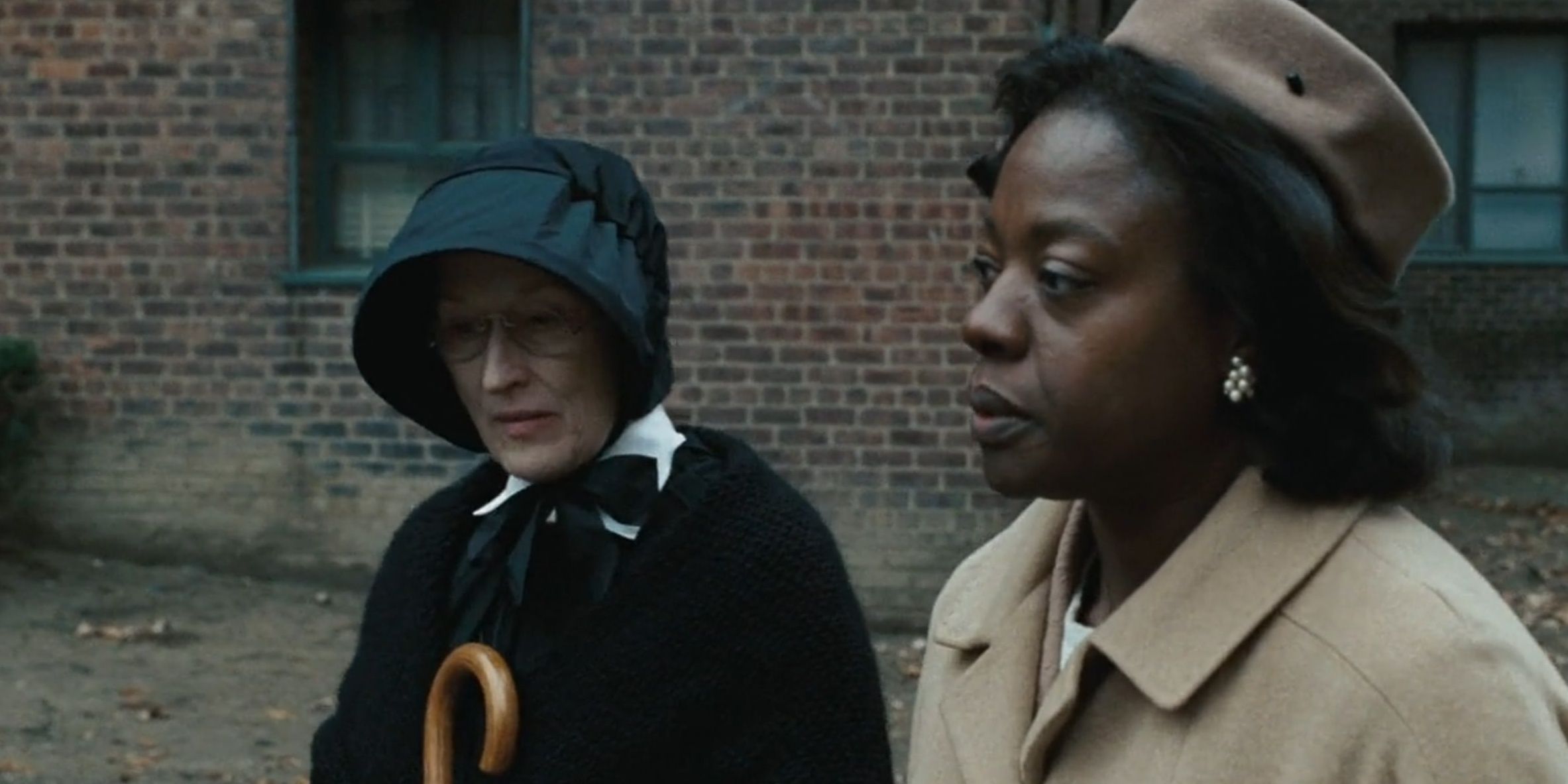 Sister Aloysius, played by Meryl Streep, walks beside Mrs. Miller, played by Viola Davis, in Doubt