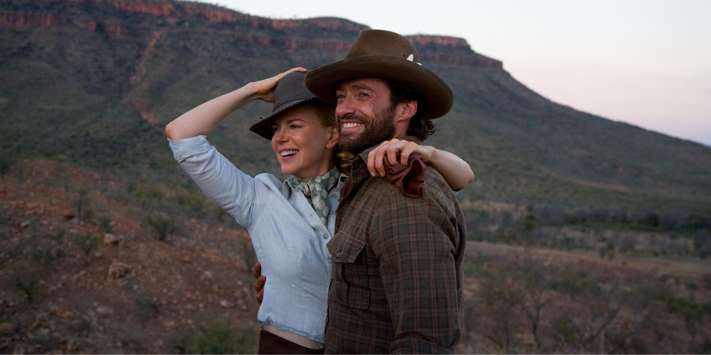 Lady Sarah Ashley (Nicole Kidman) et The Drover (Hugh Jackman) souriants dans les plaines de l'outback de Faraway Downs