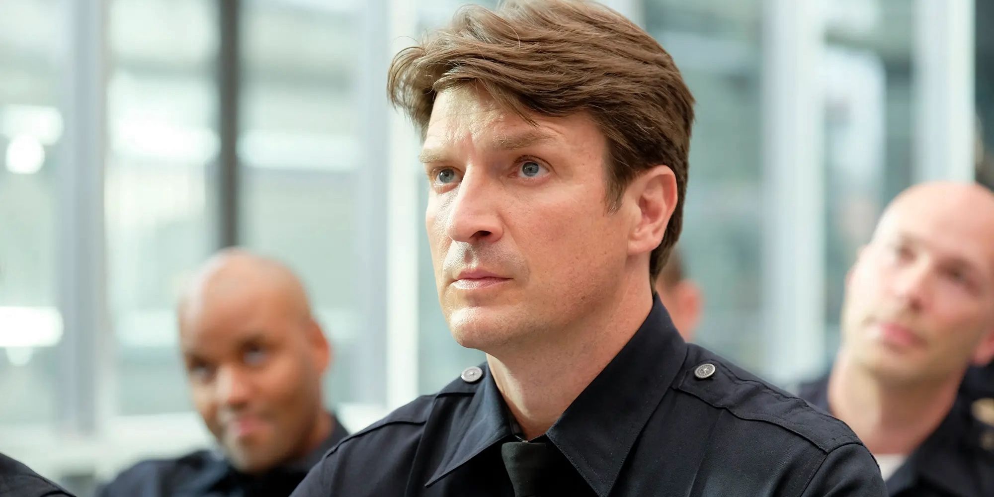 Nathan Fillion raising his eyebrow suspiciously in 'The Rookie' on ABC