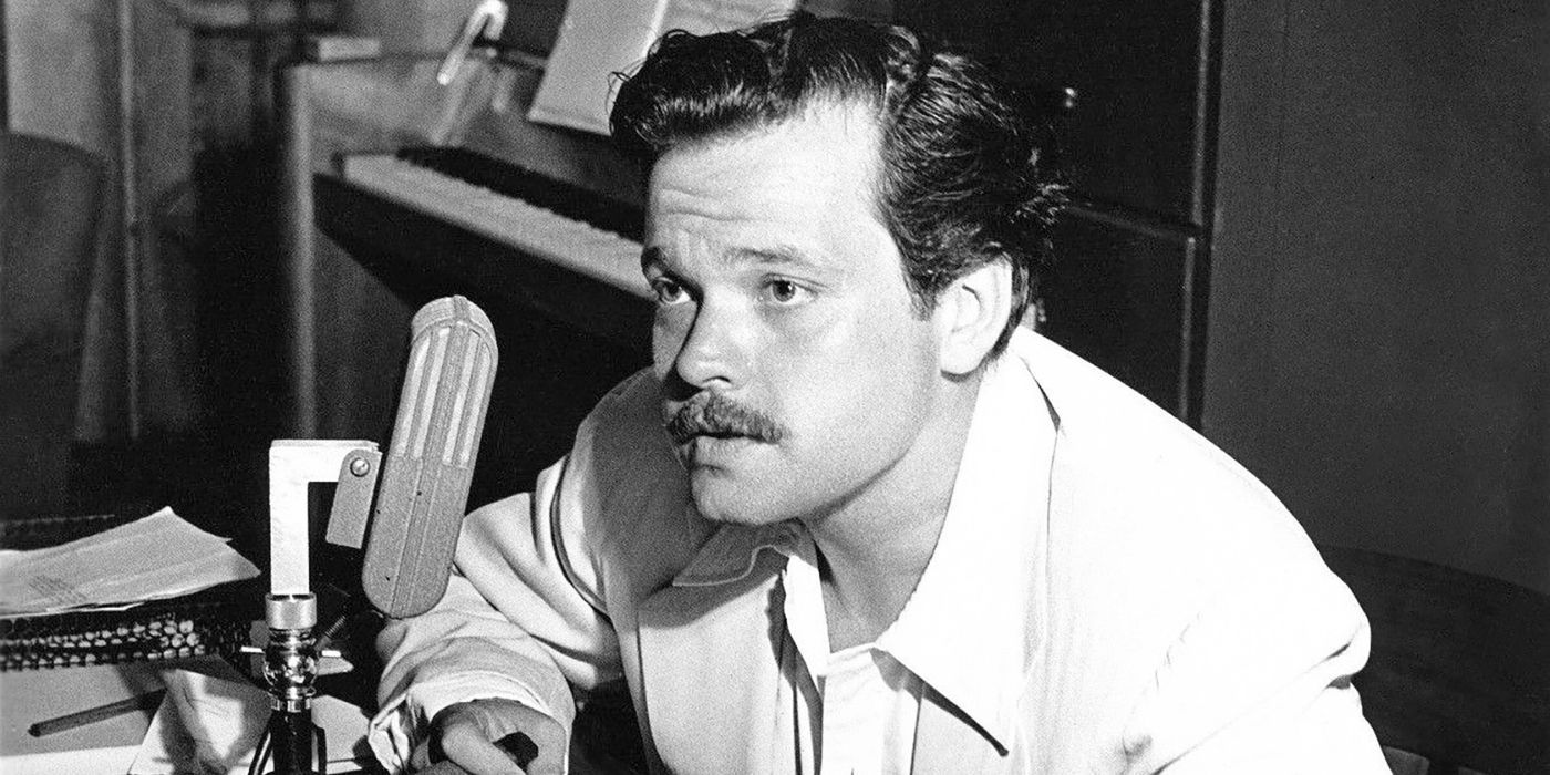 Orson Welles speaking into a radio microphone during a CBS program