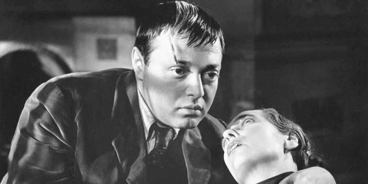 Peter Lorre as Abbott holding a man in his arms in The Man Who Knew Too Much 