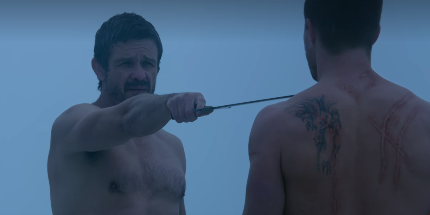 Ra's Al Ghul pointing a sword at Oliver Queen in Arrow