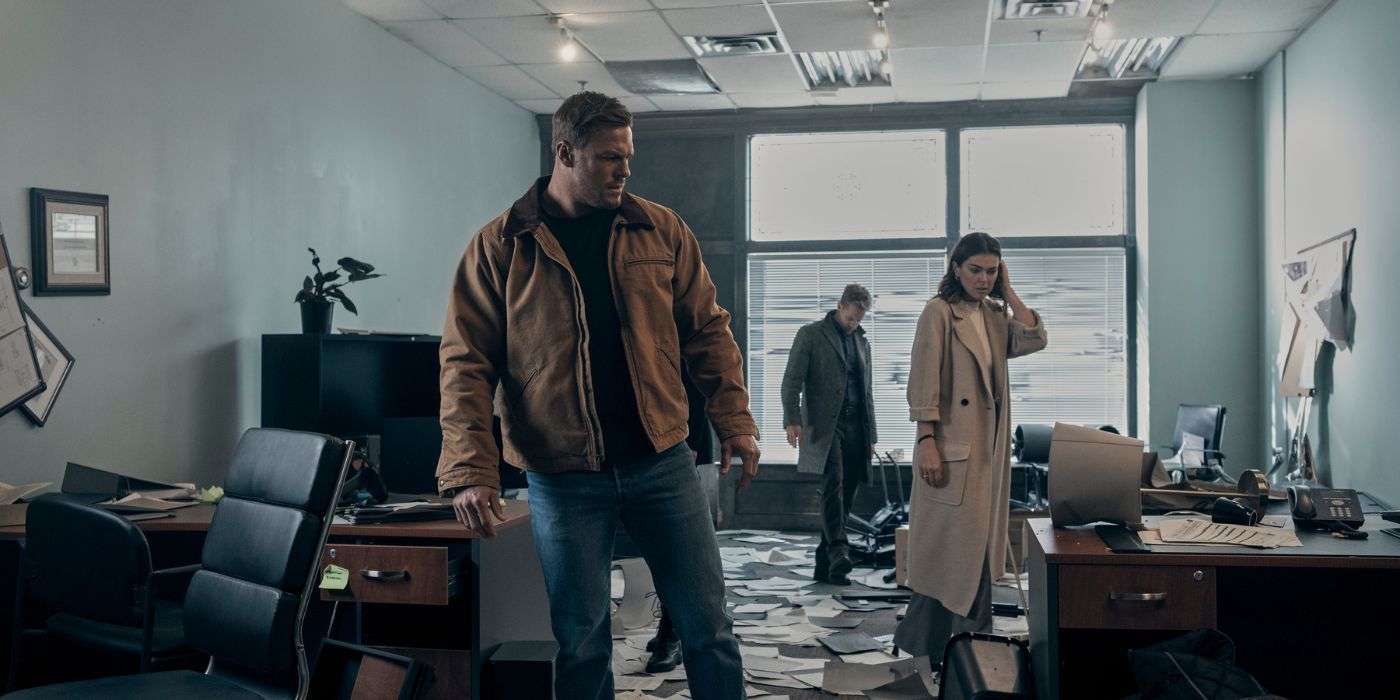 Alan Ritchson, Serinda Swan, and Shaun Sipos as Jack Reacher, Karla Dixon, and David O'Donnell investigating an office building in Reacher Season 2