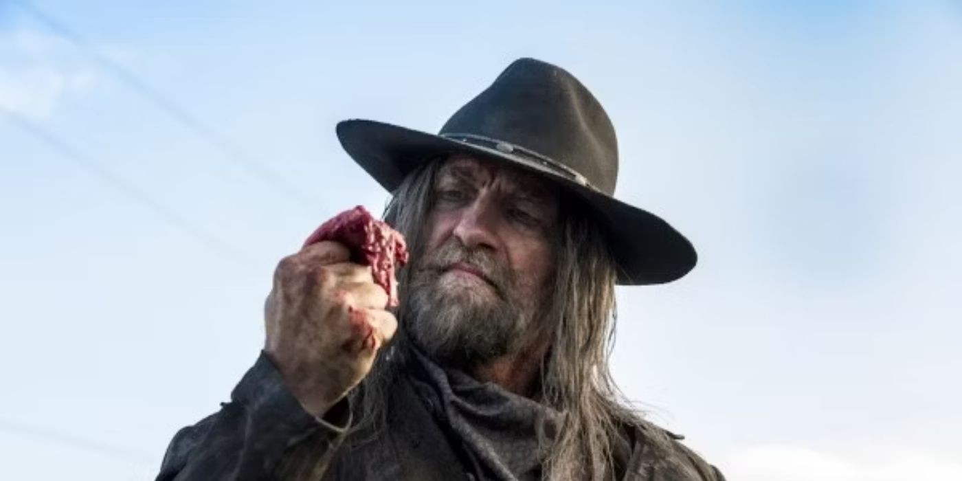 Graham McTavish as The Saint Of Killers holding up a piece of flesh in Preacher Season 1