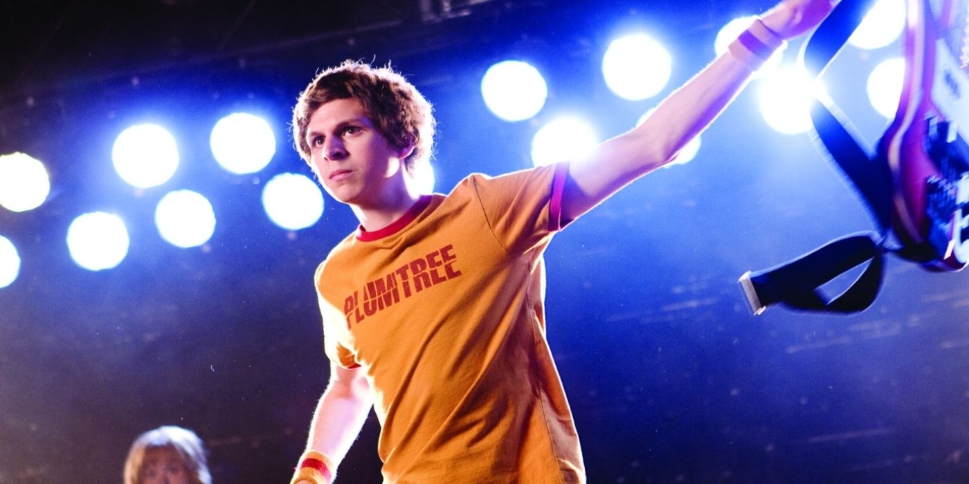 Michael Cera as Scott Pilgrim tossing his guitar aside as he gets ready to fight in Scott Pilgrim vs. The World