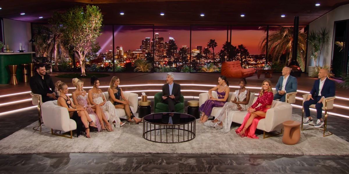 The cast of season seven of selling sunset sit on couches at the reunion with host Tan France interviewing
