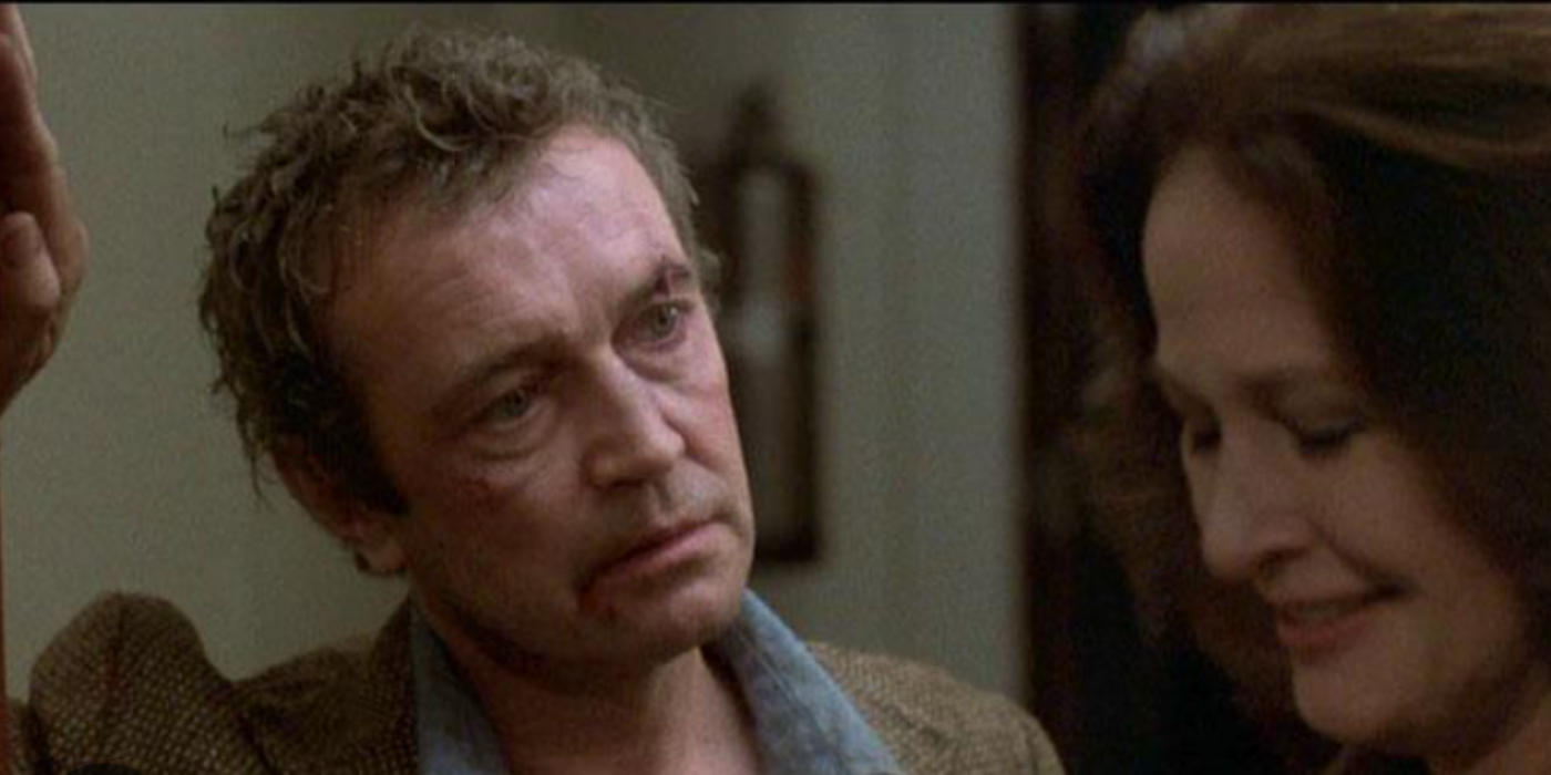 Tony Beckley as Curt Duncan looking at Rutanya Alda as Mrs. Mandrakis who is smiling in When A Stranger Calls