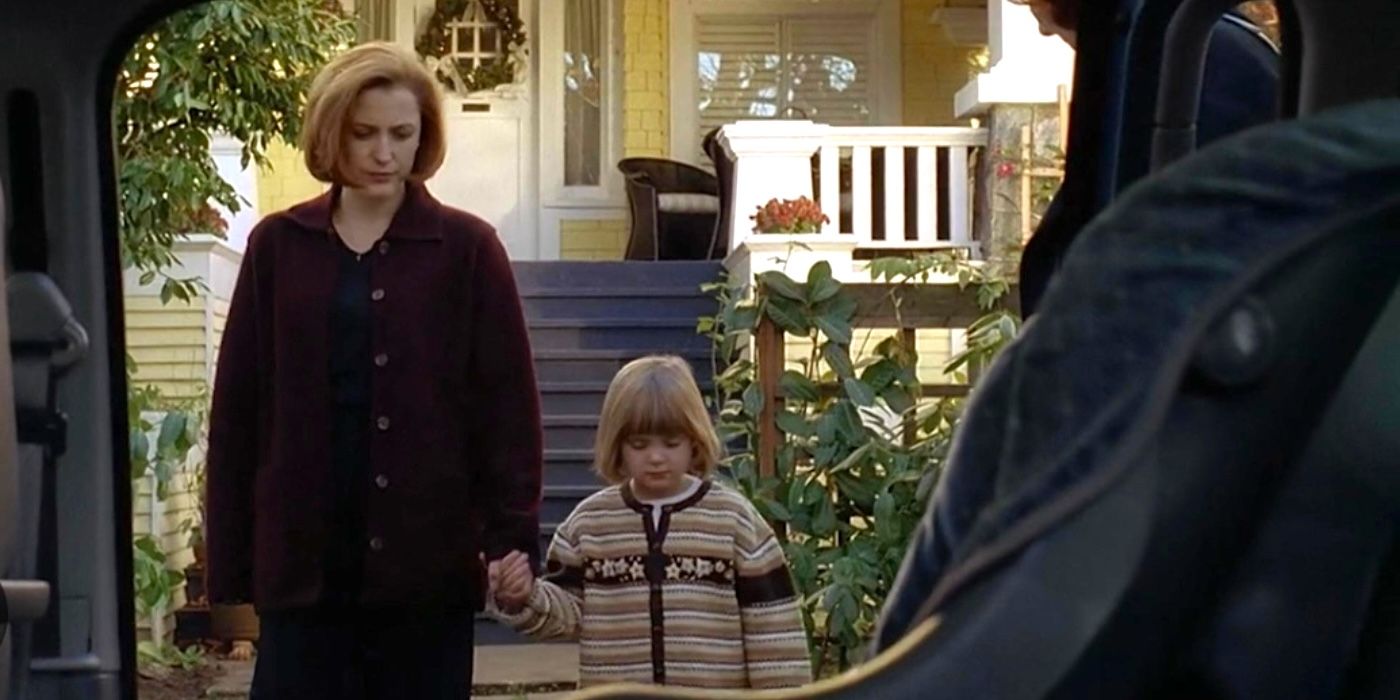 Agent Scully and Emily share a moment from the episode "Christmas Carol" from 'The X-Files'