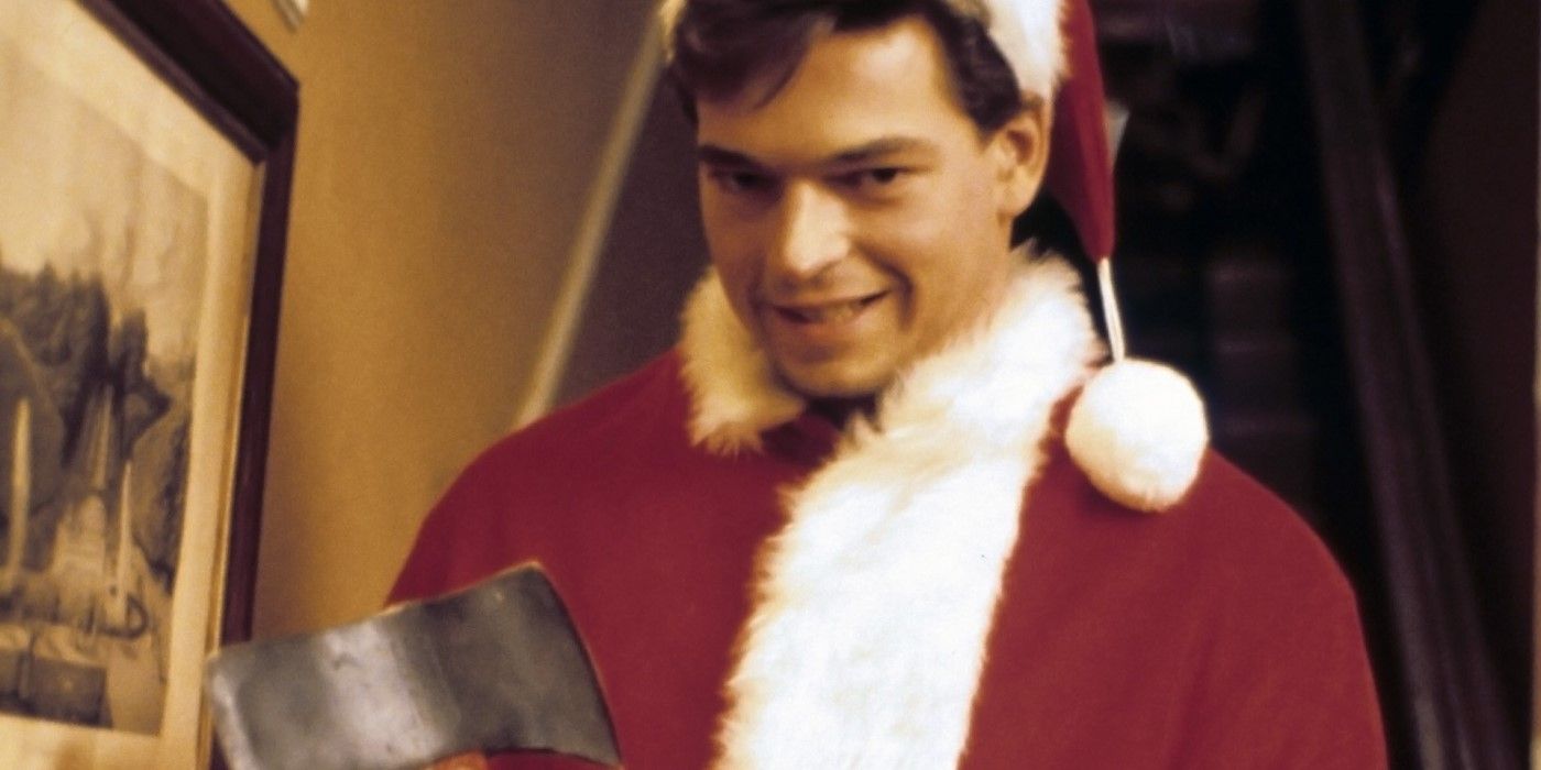 A man in a Santa Claus suit smiling while holding an axe in 'Silent Night, Deadly Night Part 2'