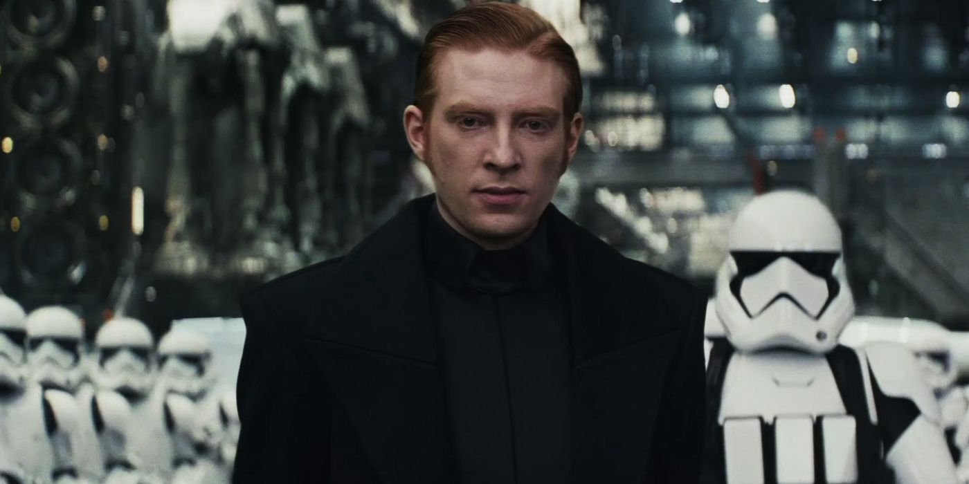 General Hux (Domhnall Gleeson) glaring with First Order Stormtroopers behind him.