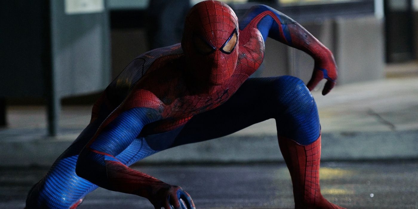 Spider-Man doing a pose on the street at night in The Amazing Spider-Man