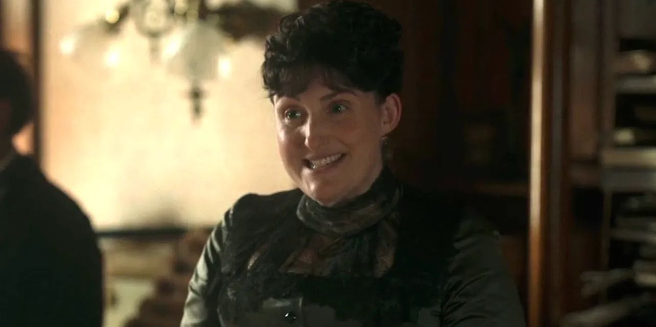 Emily Warren Roebling (Liz Wisan) smiling in 'The Gilded Age'