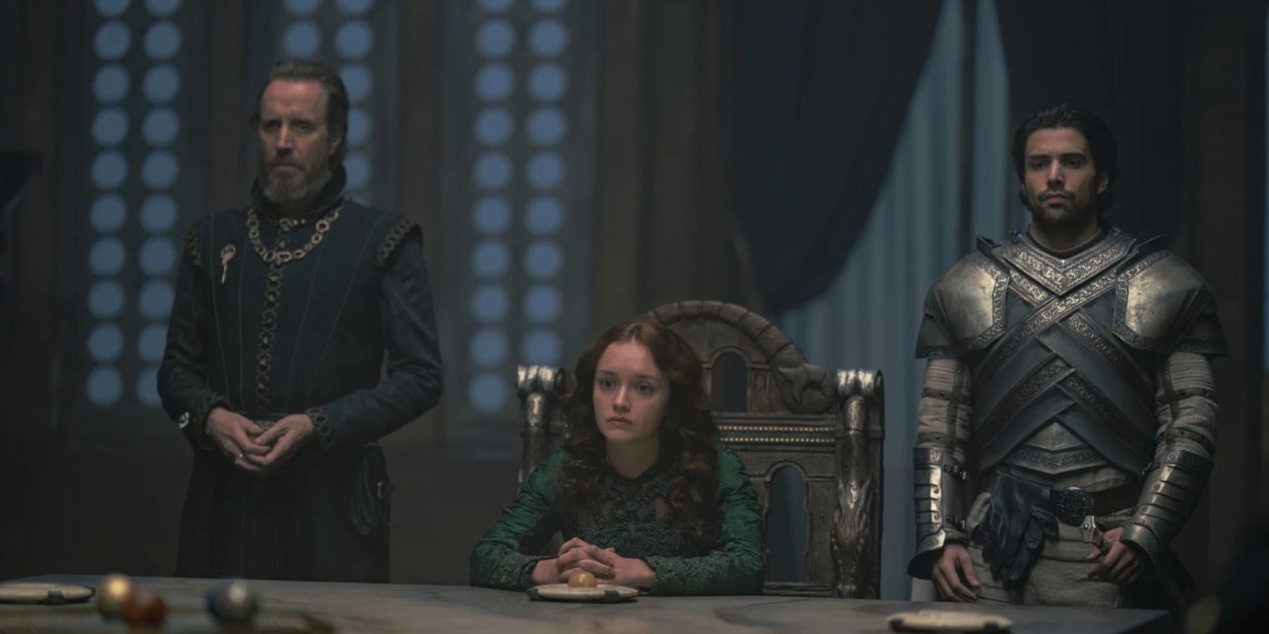 Olivia Cook as Alicent Hightower sitting down with Ser Criston Cole stands in armor