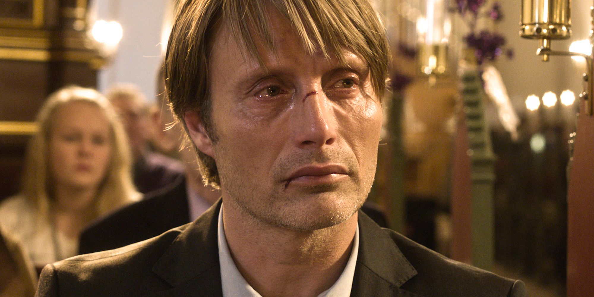Mads Mikkelsen as Lucas crying and looking intently off-camera in The Hunt
