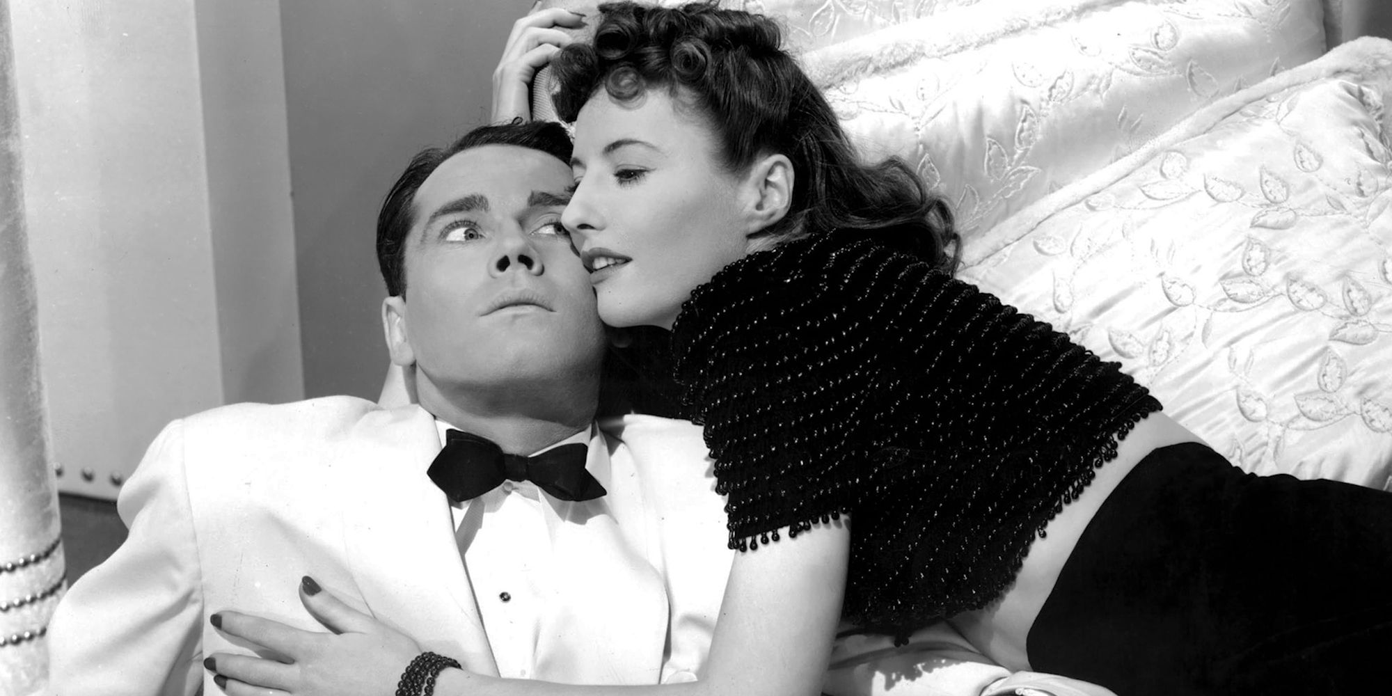 Henry Fonda and Barbara Stanwyck as Charles and Jean embracing in The Lady Eve