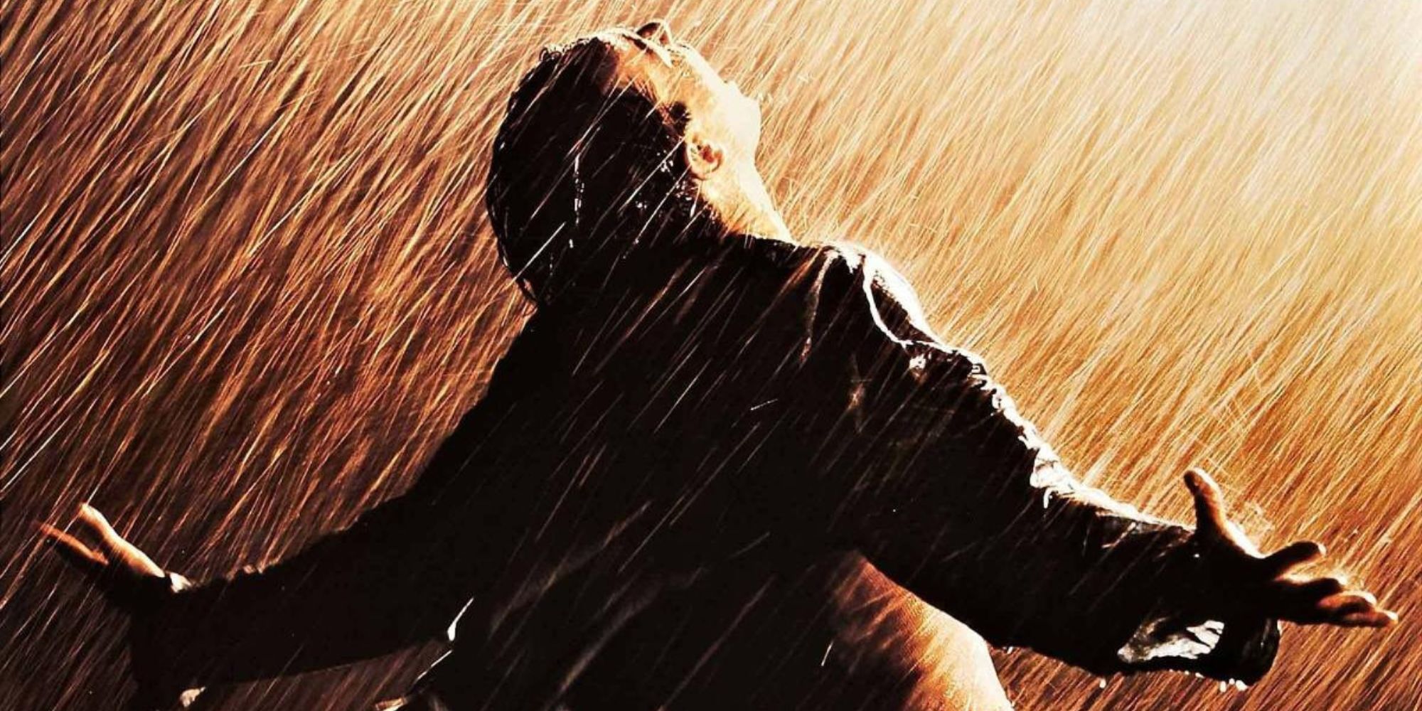 A mand with his arms spread under the rain in The Shawshank Redemption poster