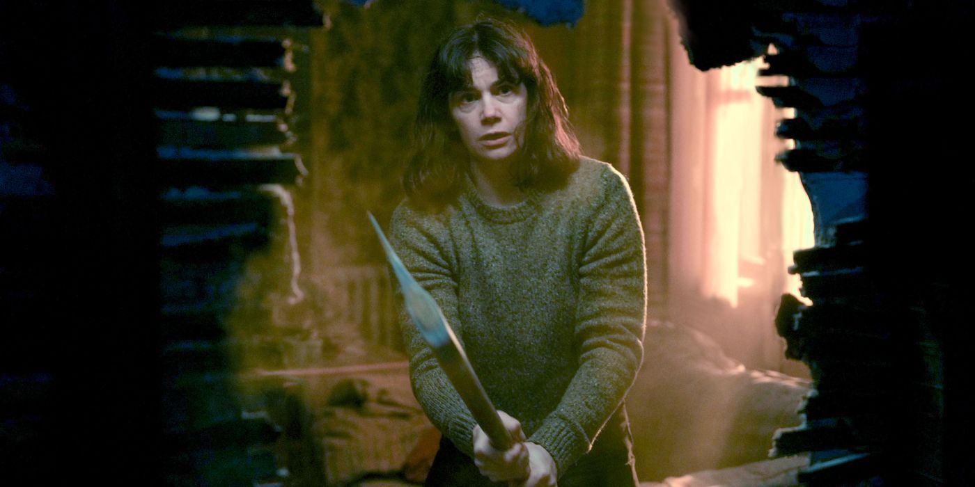 Lorna Brady (Ruth Wilson) holding an axe in The Woman in the Wall