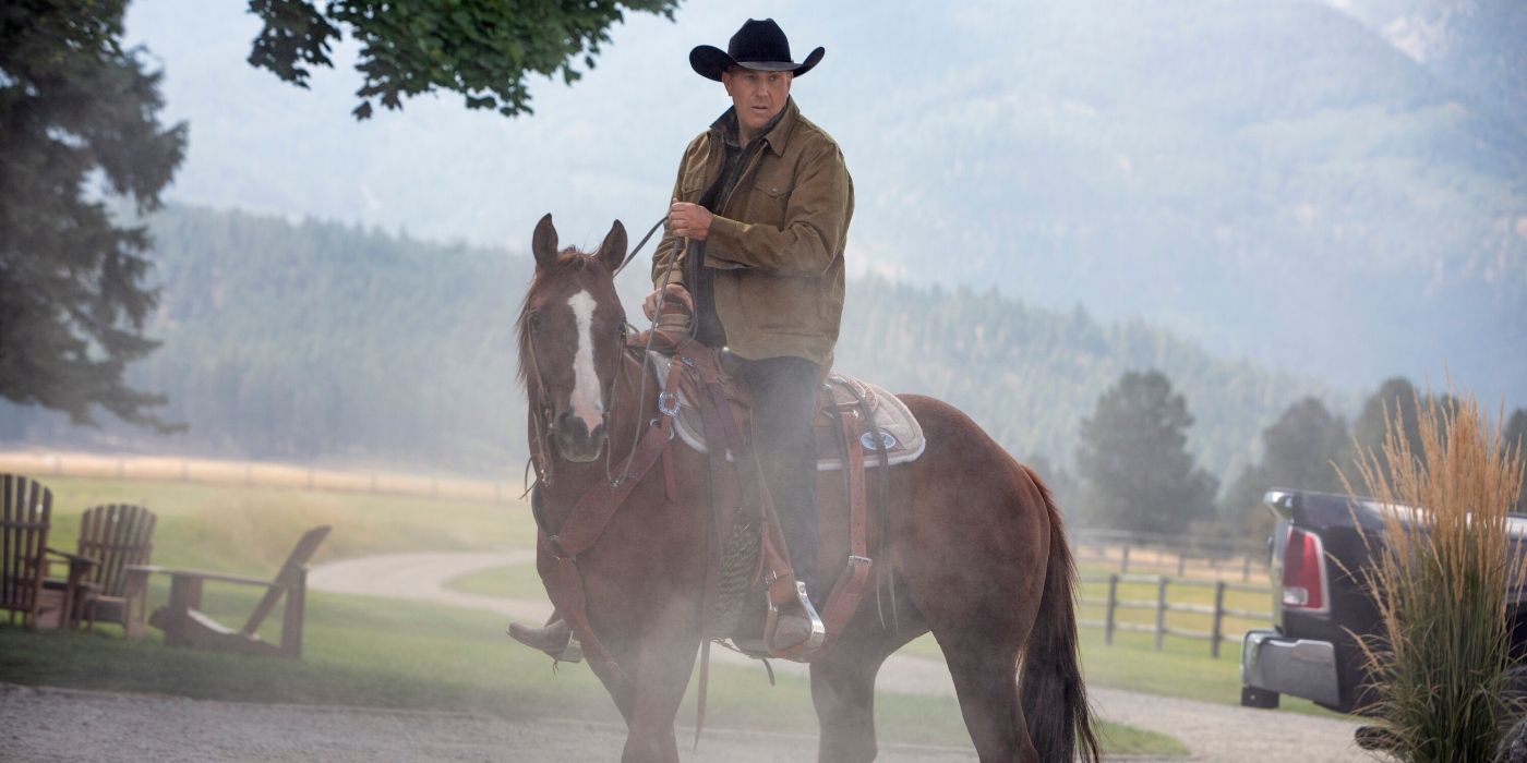Kevin Costner's John Dutton riding a horse on a dirt trail in Yellowstone