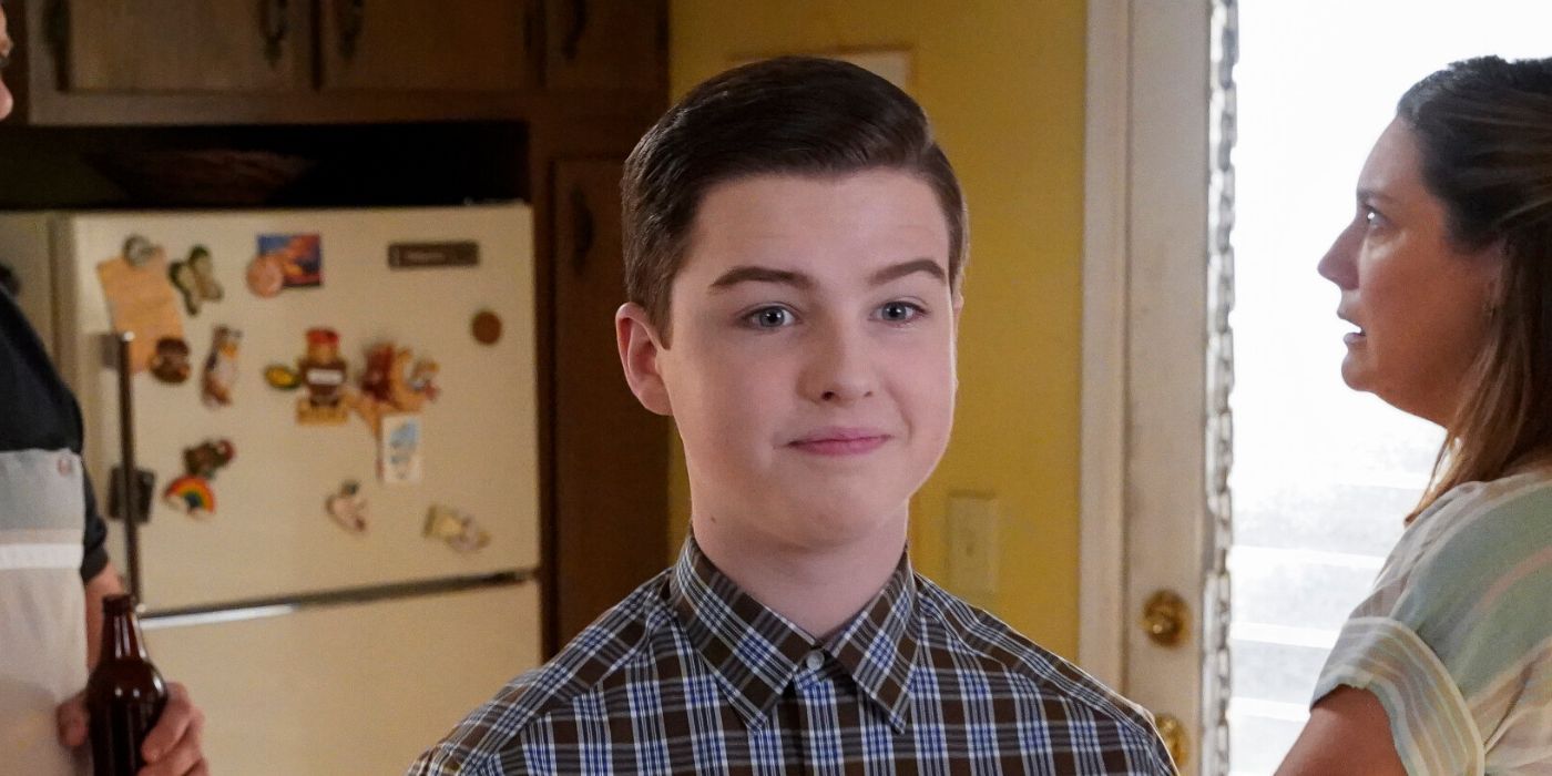 Sheldon Cooper (Iain Armitage) standing in his family's kitchen in Young Sheldon