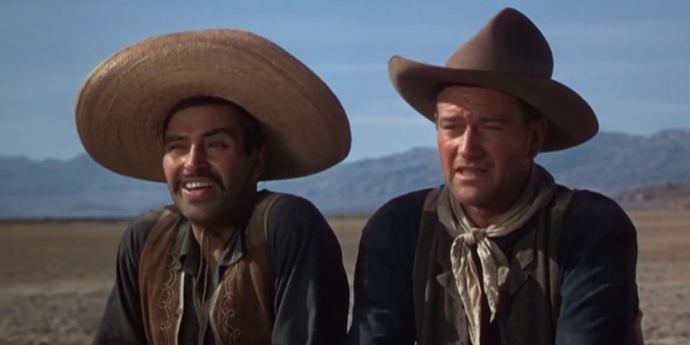 Colorized close-up of Pedro Armandariz as Pedro Roca Fuerte and John Wayne as Robert Hightower in 3 Godfathers