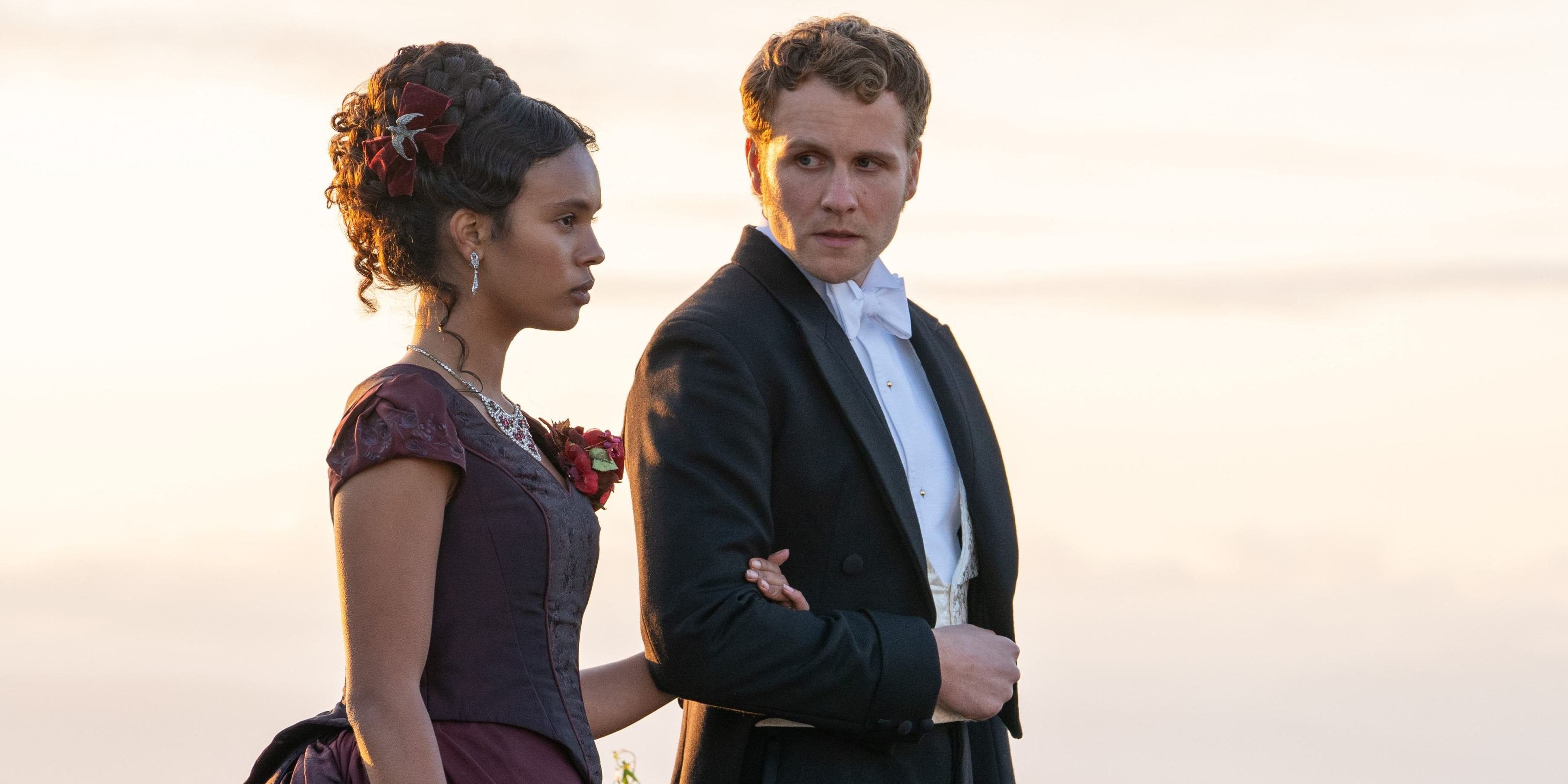 Alisha Boe as Conchitta holds the arm of Josh Dylan as Richard in The Buccaneers