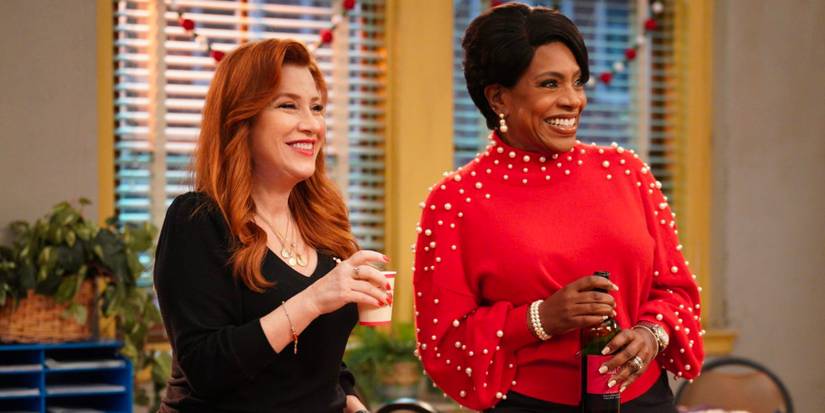 Two teachers share a drink at an office party.