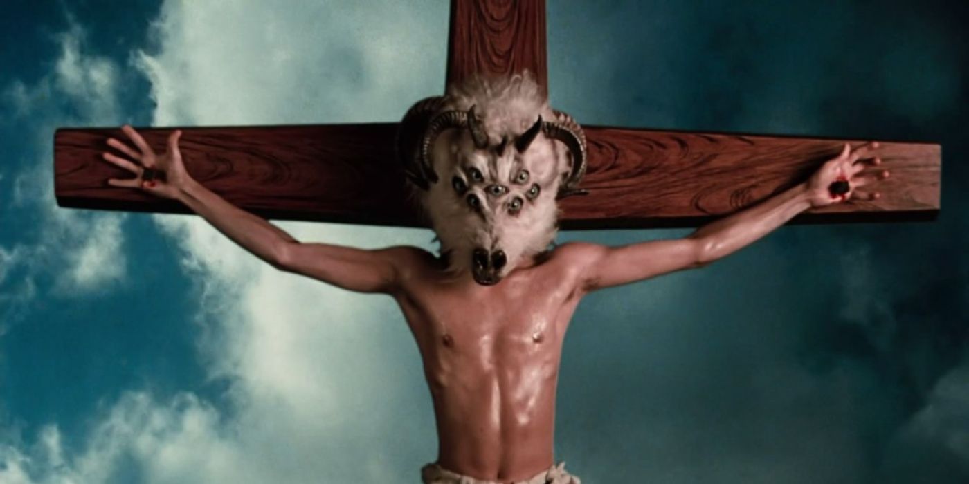 A man with a ram's head with a bunch of eyeballs nailed to a cross in Altered States (1980)