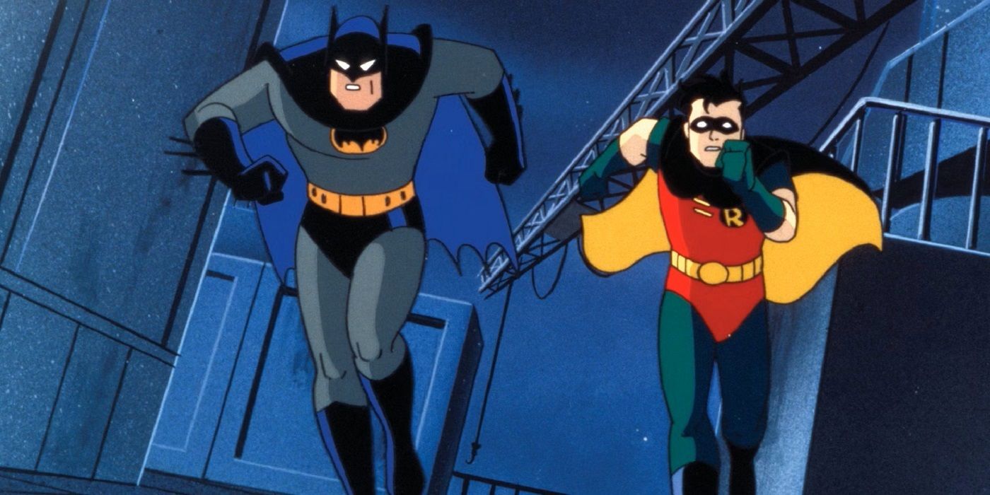 Batman (voiced by Kebin Conroy) and Robin (voiced by Loren Lester) running in an alleyway in Batman: The Animated Series