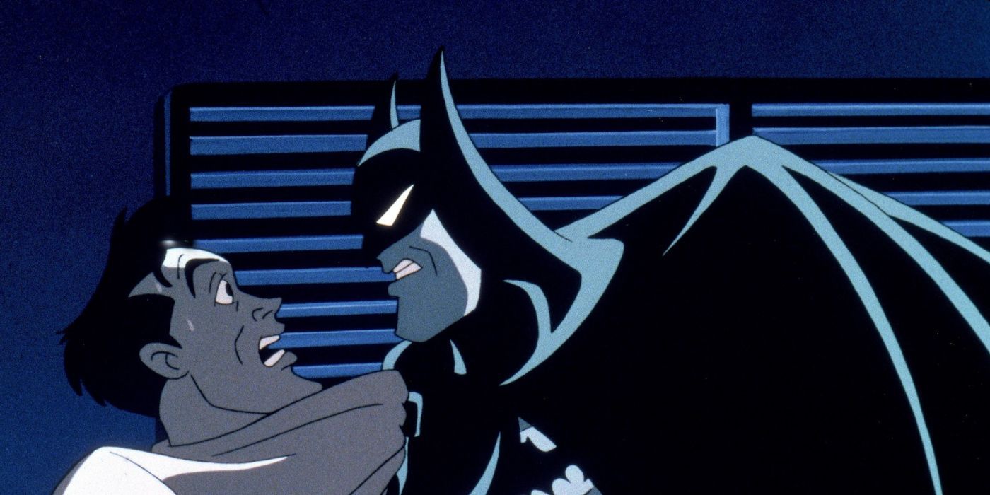 Batman agarra el cuello de un hombre asustado en Batman Mask of Phantasm