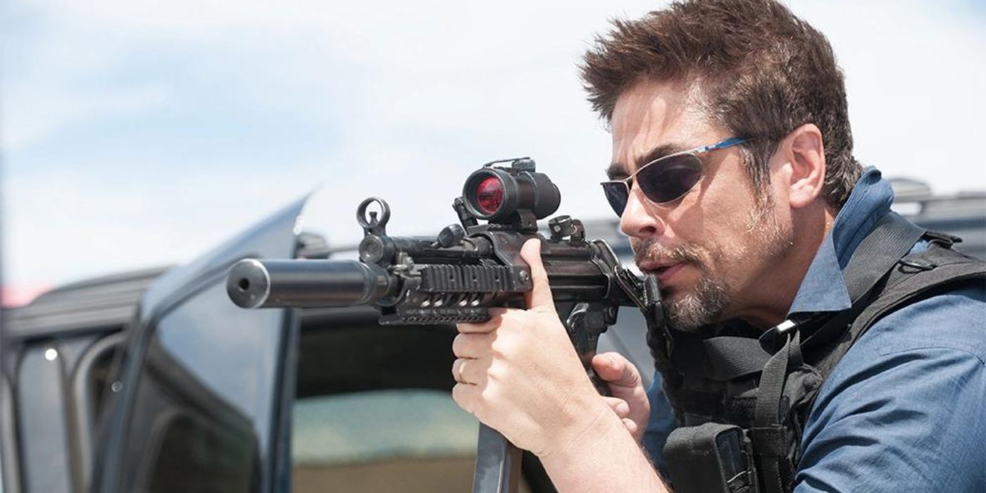 Benicio Del Toro as Alejandro aiming a gun in Sicario