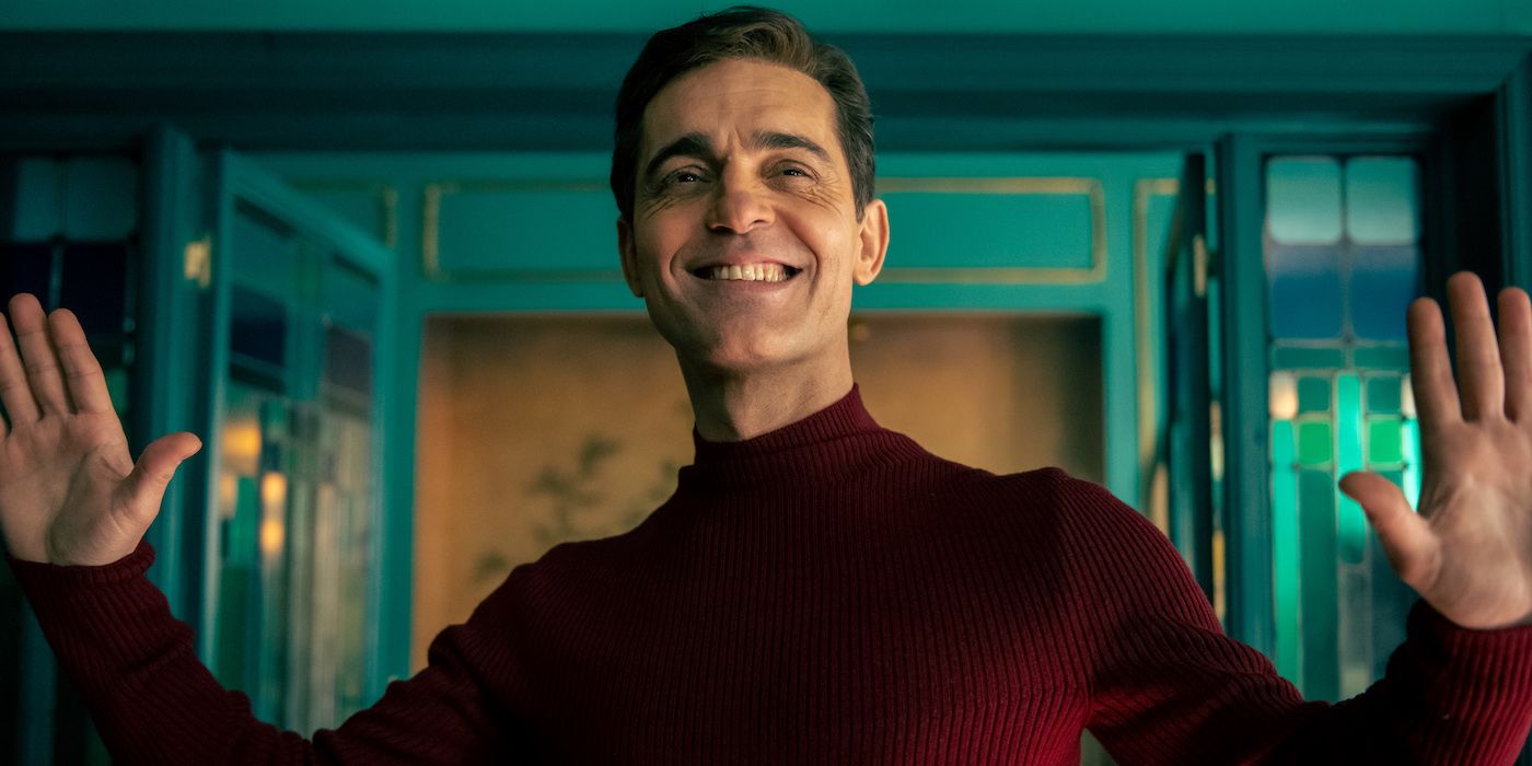 Pedro Alonso's Berlin smiling and raising his hands in Netflix's Money Heist prequel series.