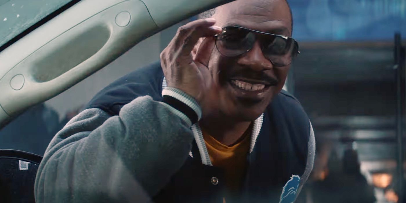 Eddie Murphy wears sunglasses, grins and leans into a car in Beverly Hills Cop: Axel Foley 