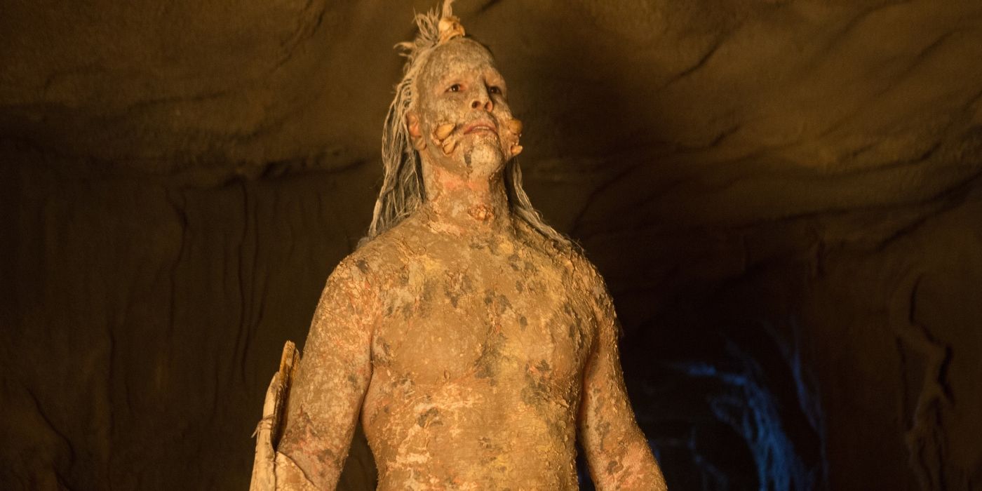 A man covered in mud inside a cave in Bone Tomahawk