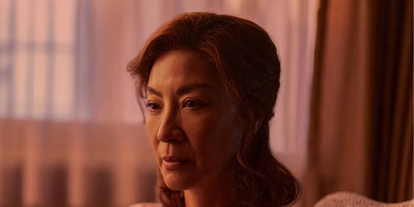 Mama Sun (Michelle Yeoh) sitting in her bedroom in The Brothers Sun