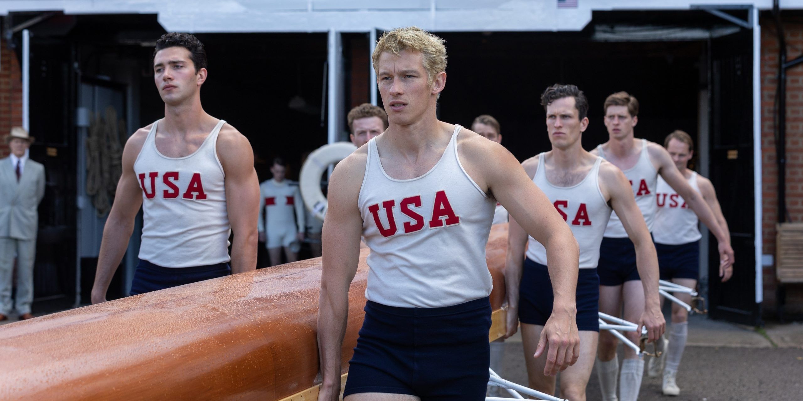 Callum Turner as Joe Rantz and the University of Washington Rowing team in The Boys in the Boat