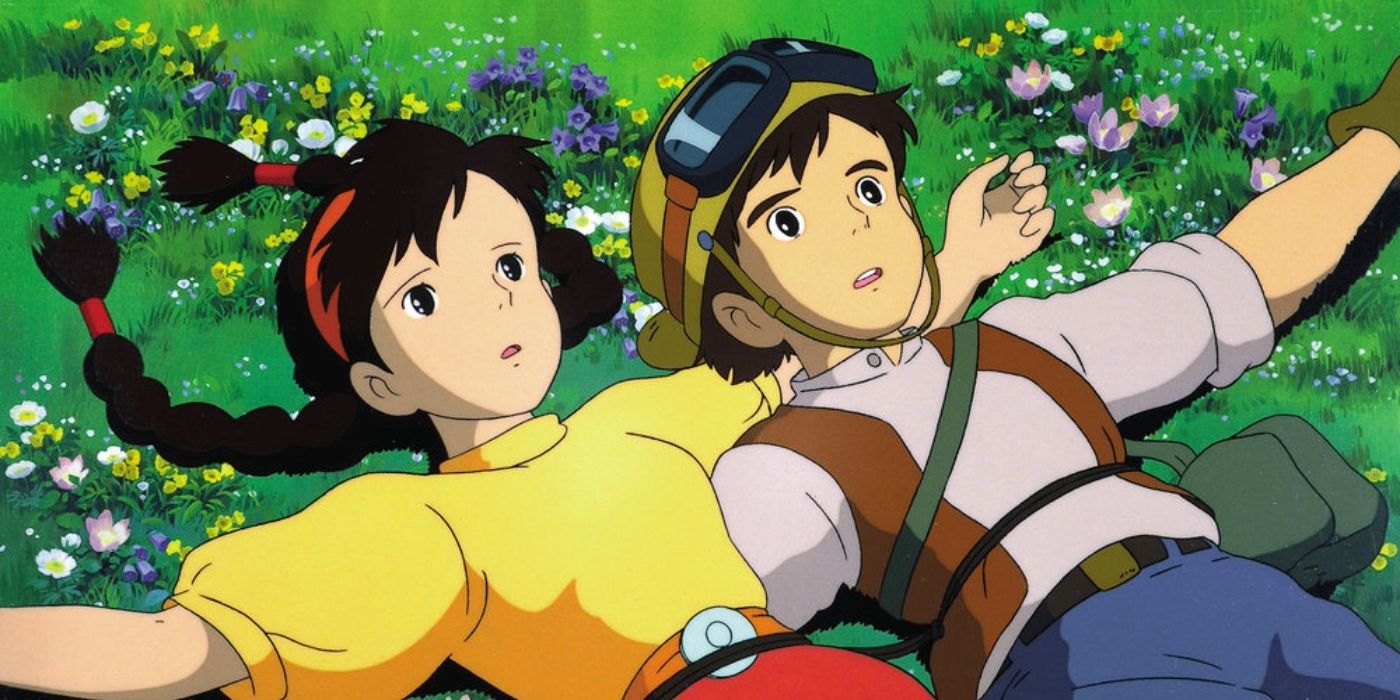 Sheeta and Pazu laying in a field in Studio Ghibli's 'Castle in the Sky'.
