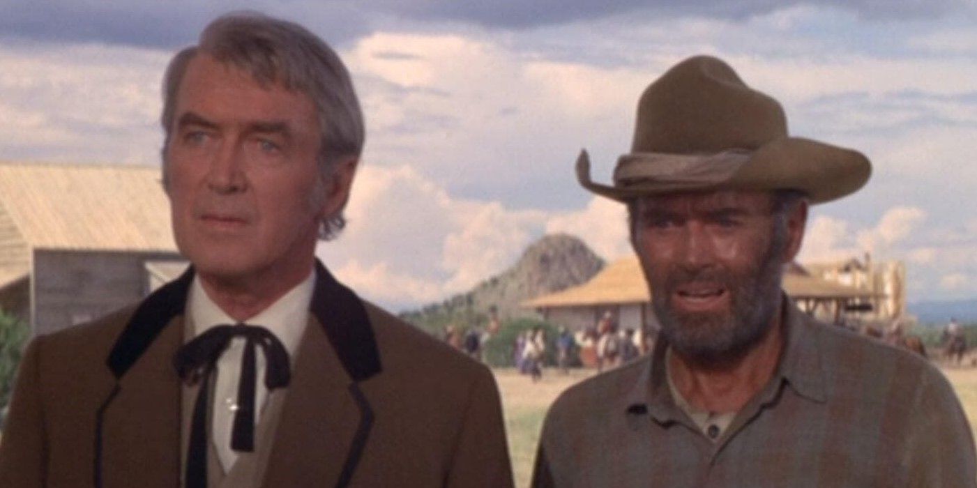 James Stewart as John O'Hanlan and Henry Fonda as Harley Sullivan standing in an Old Western town in the Cheyenne Social Club