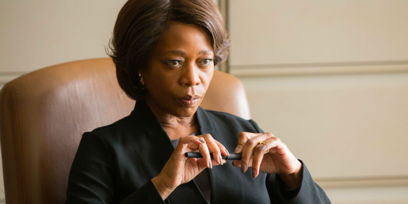 A prison warden sits behind her desk, fiddling with a pen, as she contemplates the fate of a death row inmate.